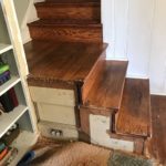 before 2 newel posts and balustrade