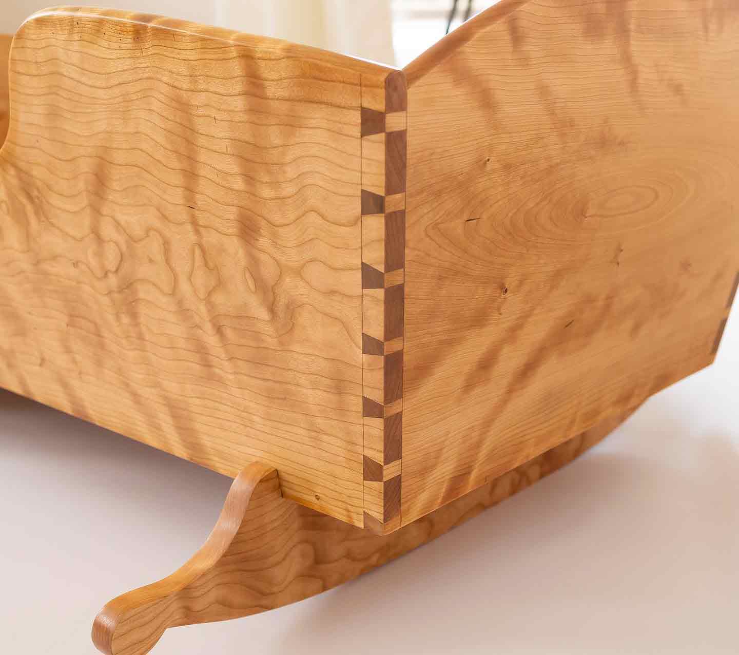 Highly figured cherry handmade wooden cradle